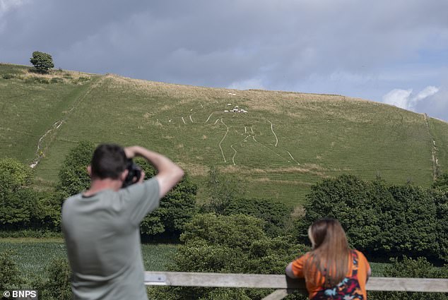 Cerine Abbas Giant restoration begins with 17 tonnes of fresh chalk.